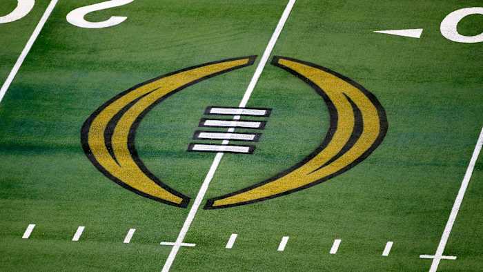 College Football Playoff logo is painted on the field